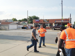 BRC employees distribute educational pamphlets about railroad crossing safety to people.