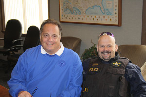 Chief Mike Romano, director of police and risk management, and Officer Jerry Conoboy, training coordinator, design the community outreach program after the Berwyn Neighborhood Watch.